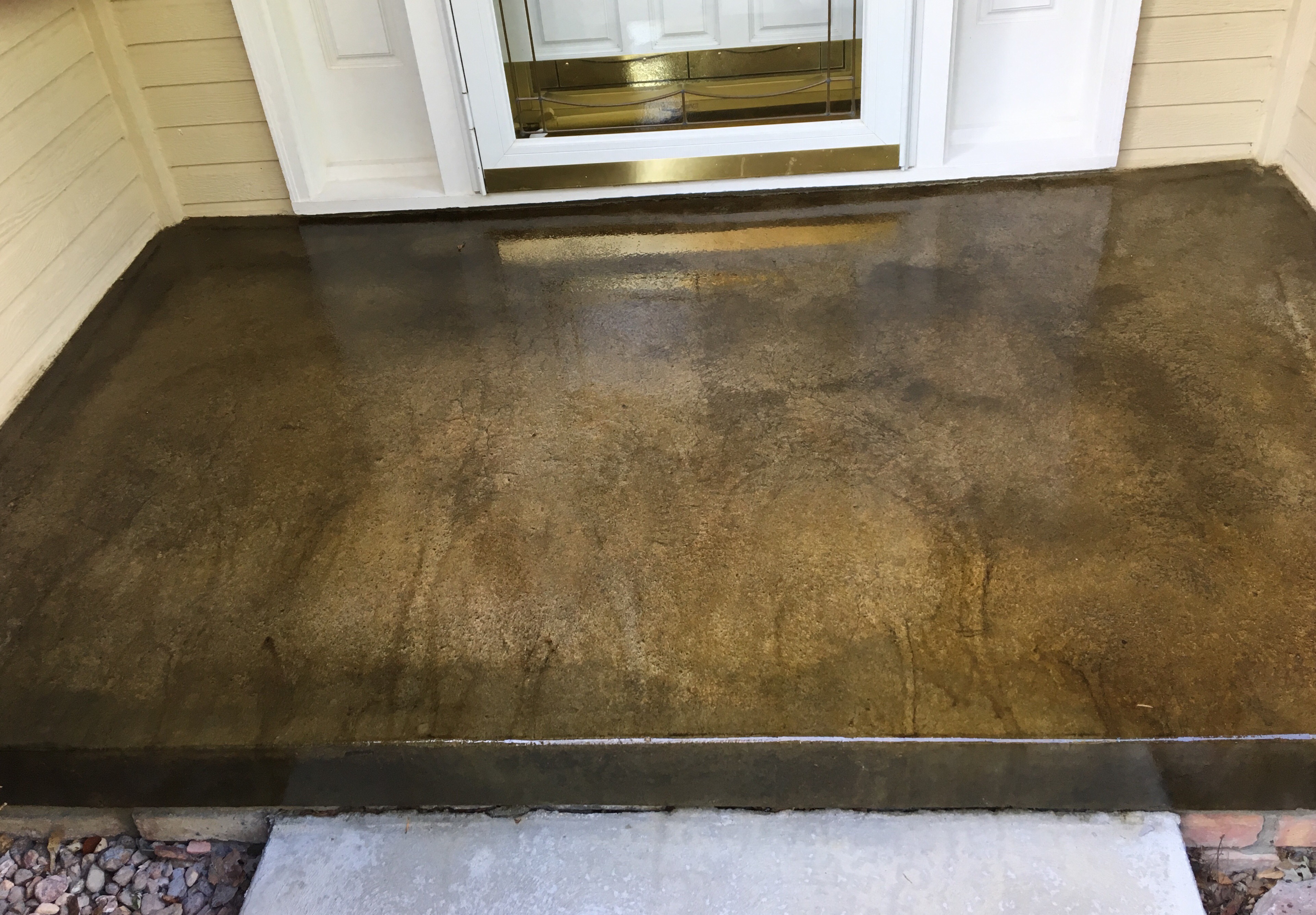 stained concrete patio before and after